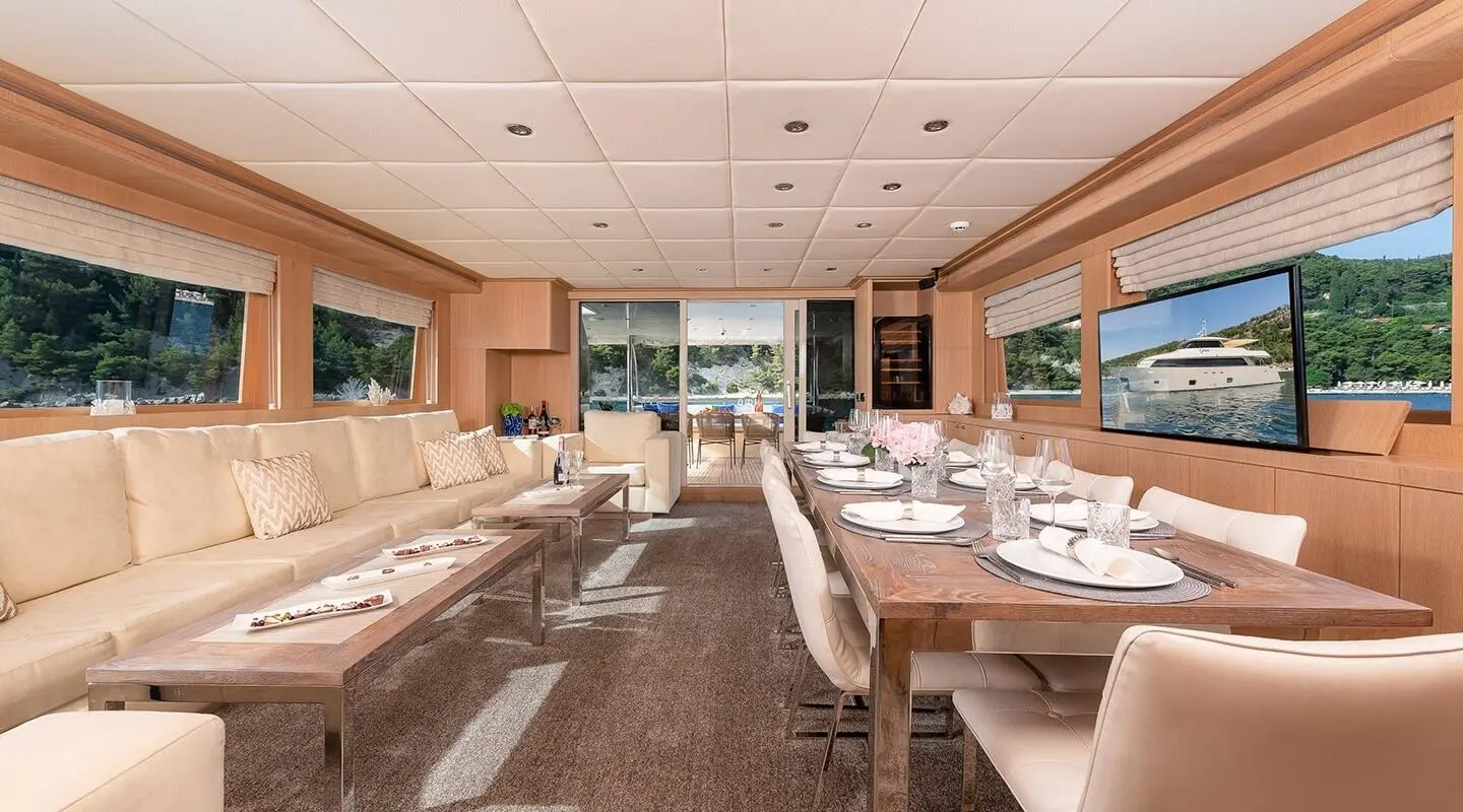 Luxurious yacht Grace saloon interior with arranged seating and tables