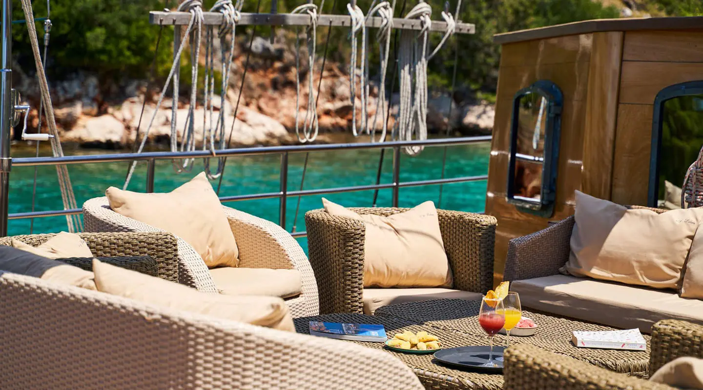 Lounge area on gulet Libra with cushions and seating near poolside