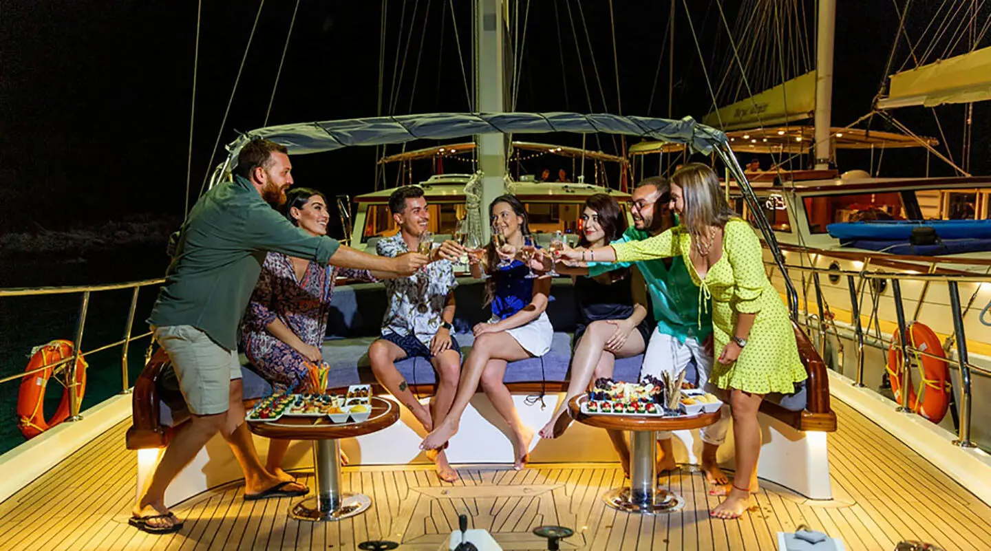 Gulet Grand Sailor sun deck crew posing for photo on yacht at dock