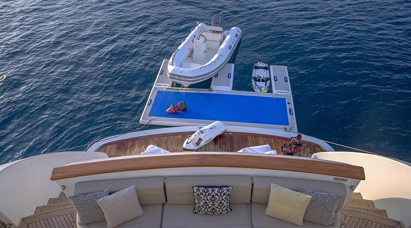 Top-down view of Aquila yacht with blue sunbathing area and open cockpit