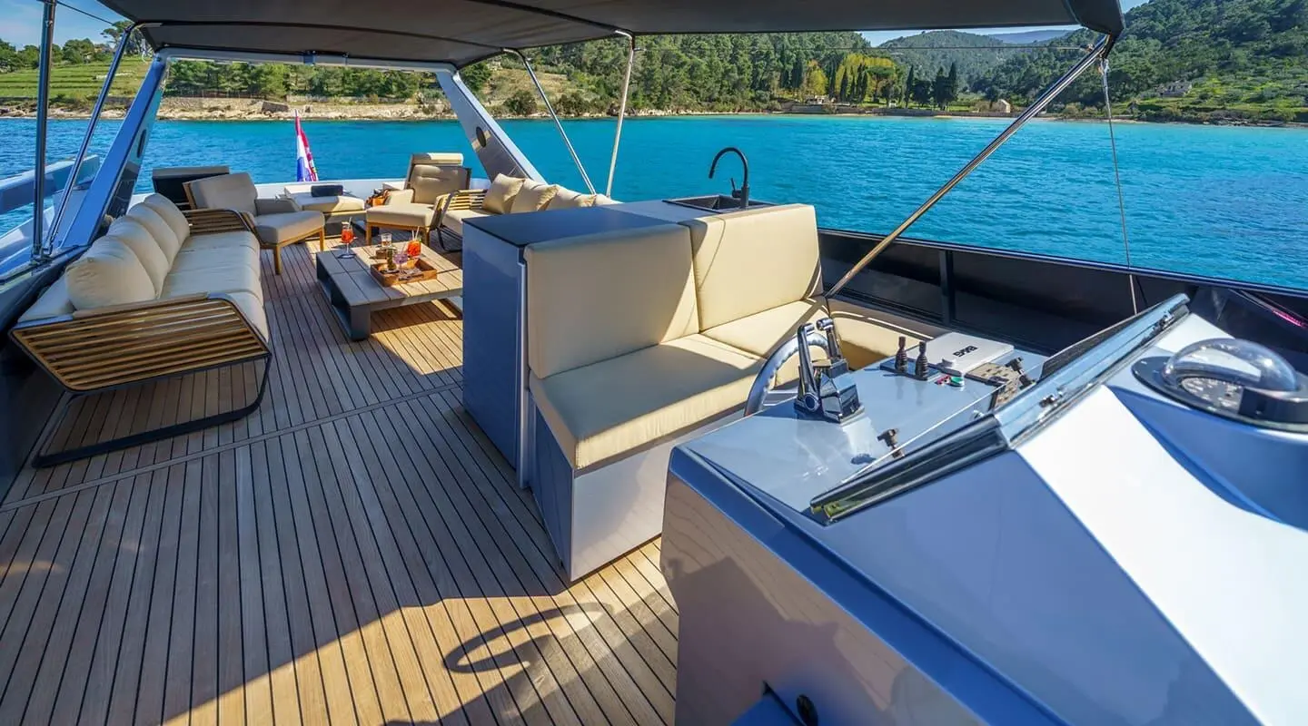 Yacht Phantom motor yacht deck with seating area overlooking blue sea