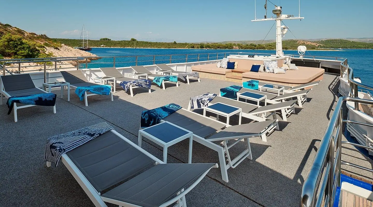 Lupus Mare yacht sun deck with loungers and cushions