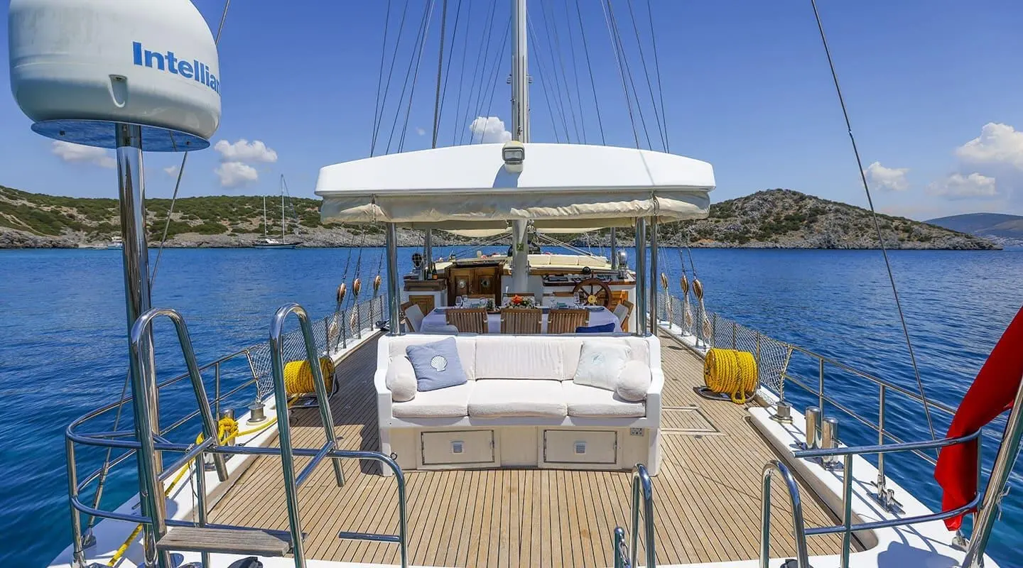 Gazella luxury gulet yacht deck at sunset with seating and calm sea