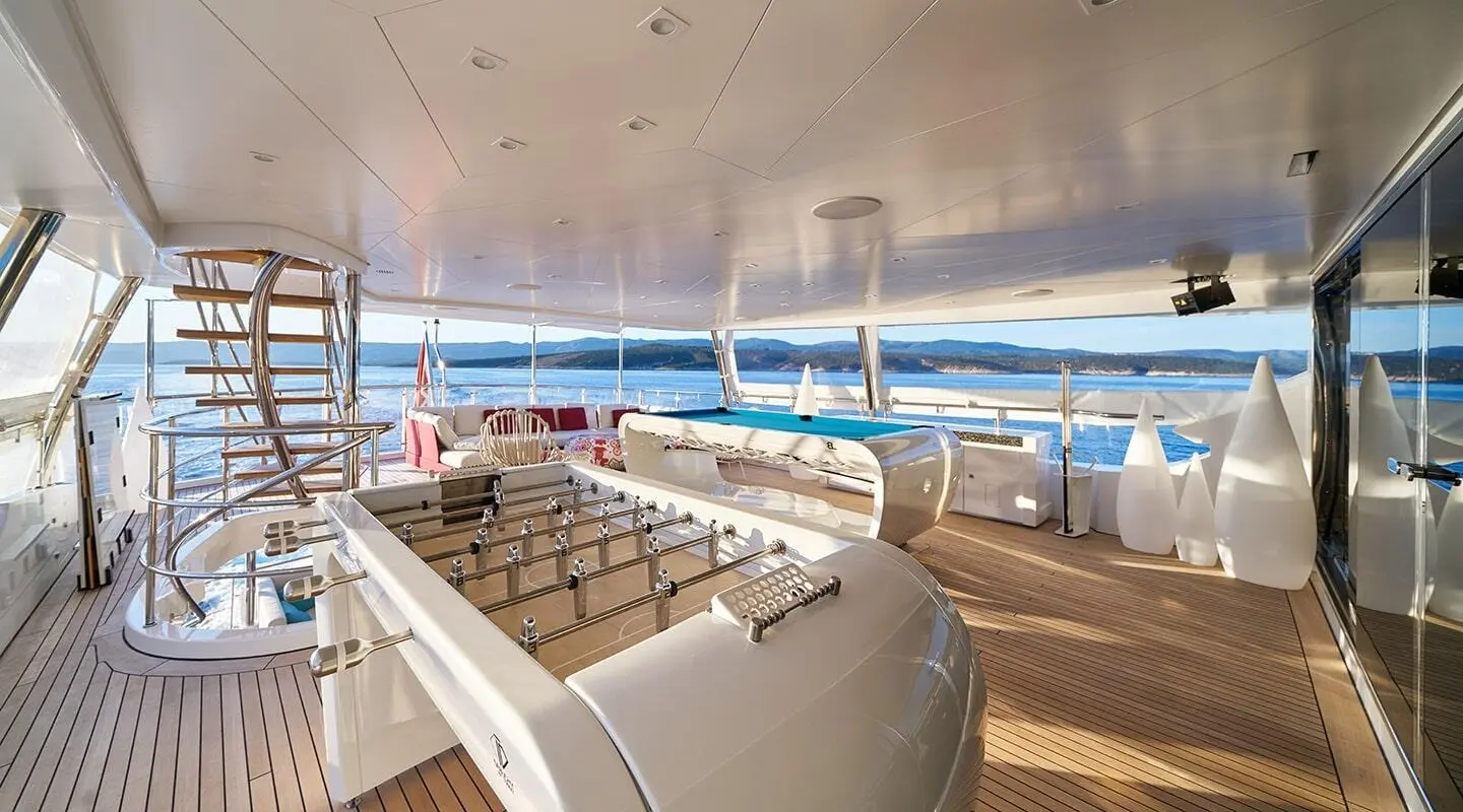Yacht Happy Me lounge deck with white seating and open view to water