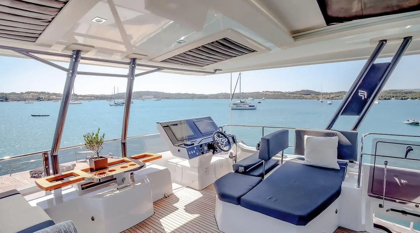 Luxurious yacht D2 flybridge with seating, sun loungers, and ocean views