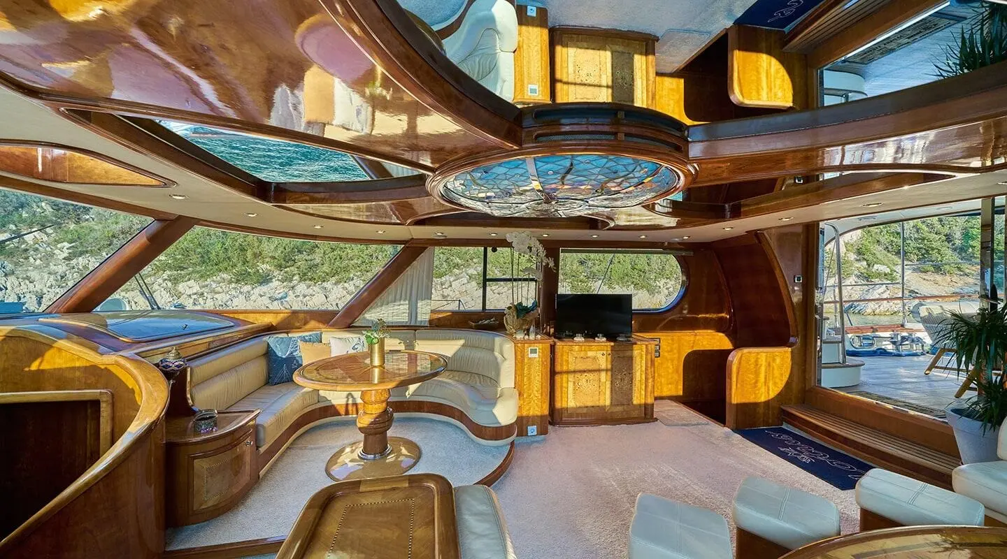 Luxurious yacht named Lotus with polished wood deck and seating areas