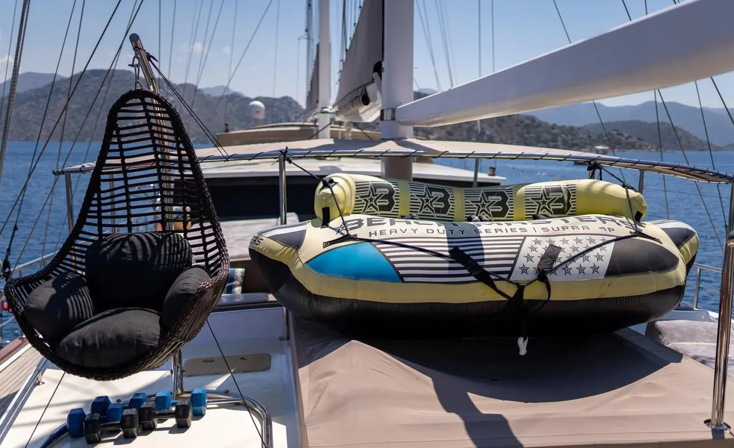 Nevra Queen gulet docked with sun deck seating and blue cushions