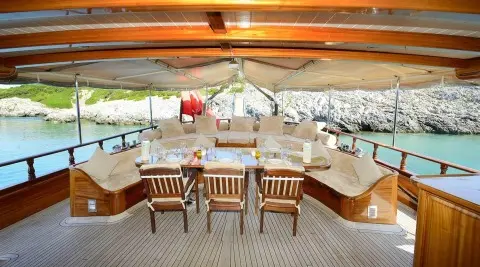 Zephyria II gulet aft deck with wooden table and chairs