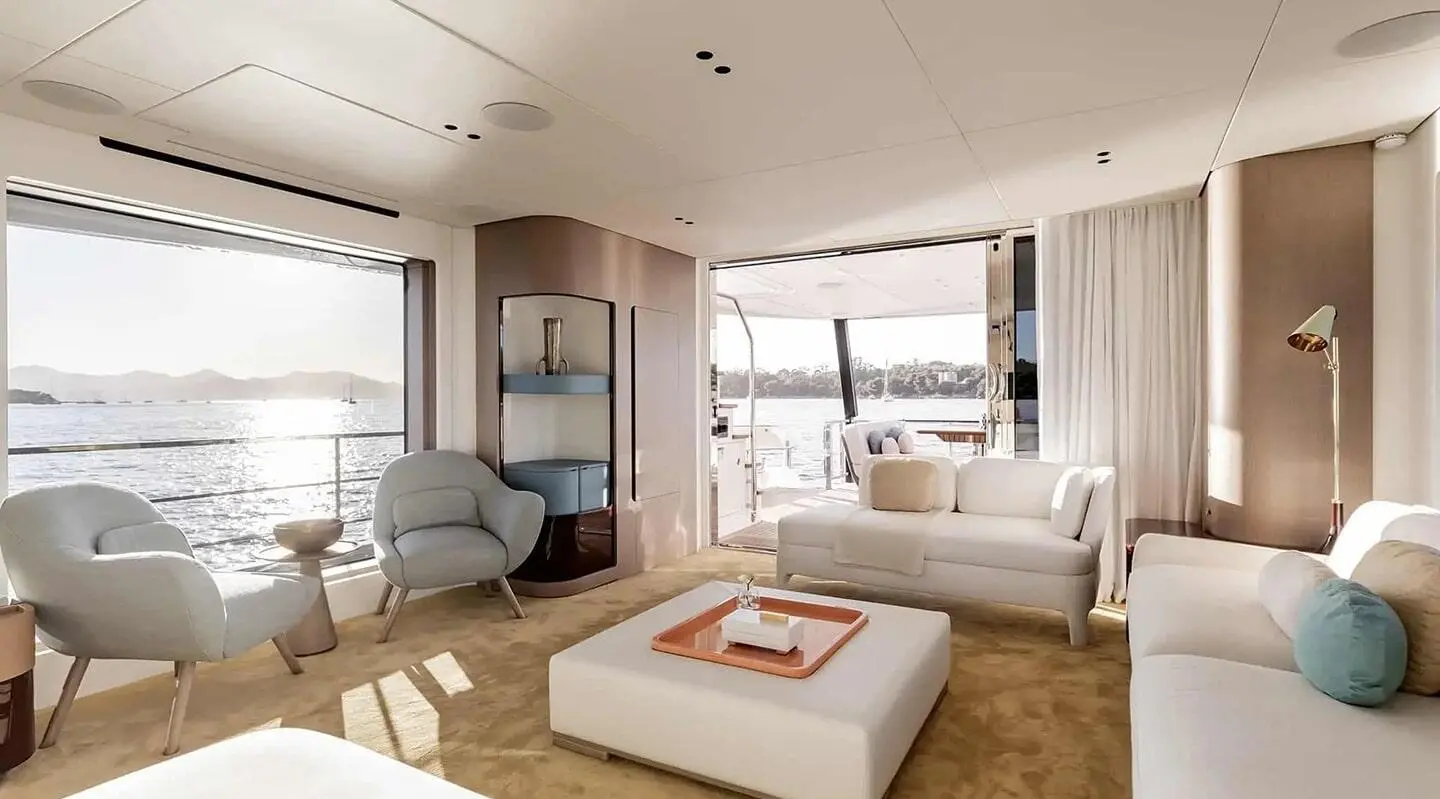 Viva II luxury motor yacht saloon interior with seating, coffee table, and large windows