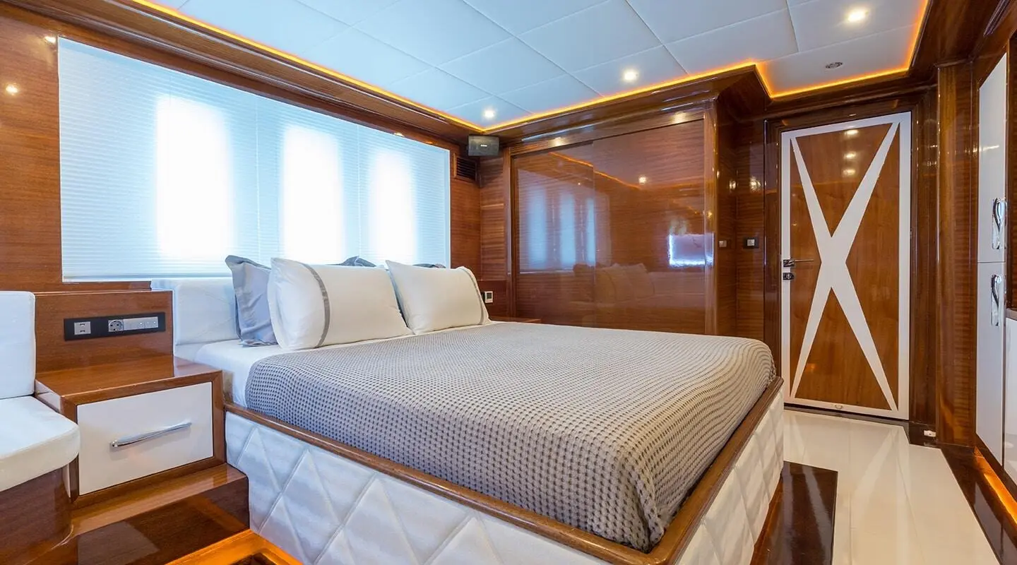 Gulet Long Island interior with double bed and wooden paneling