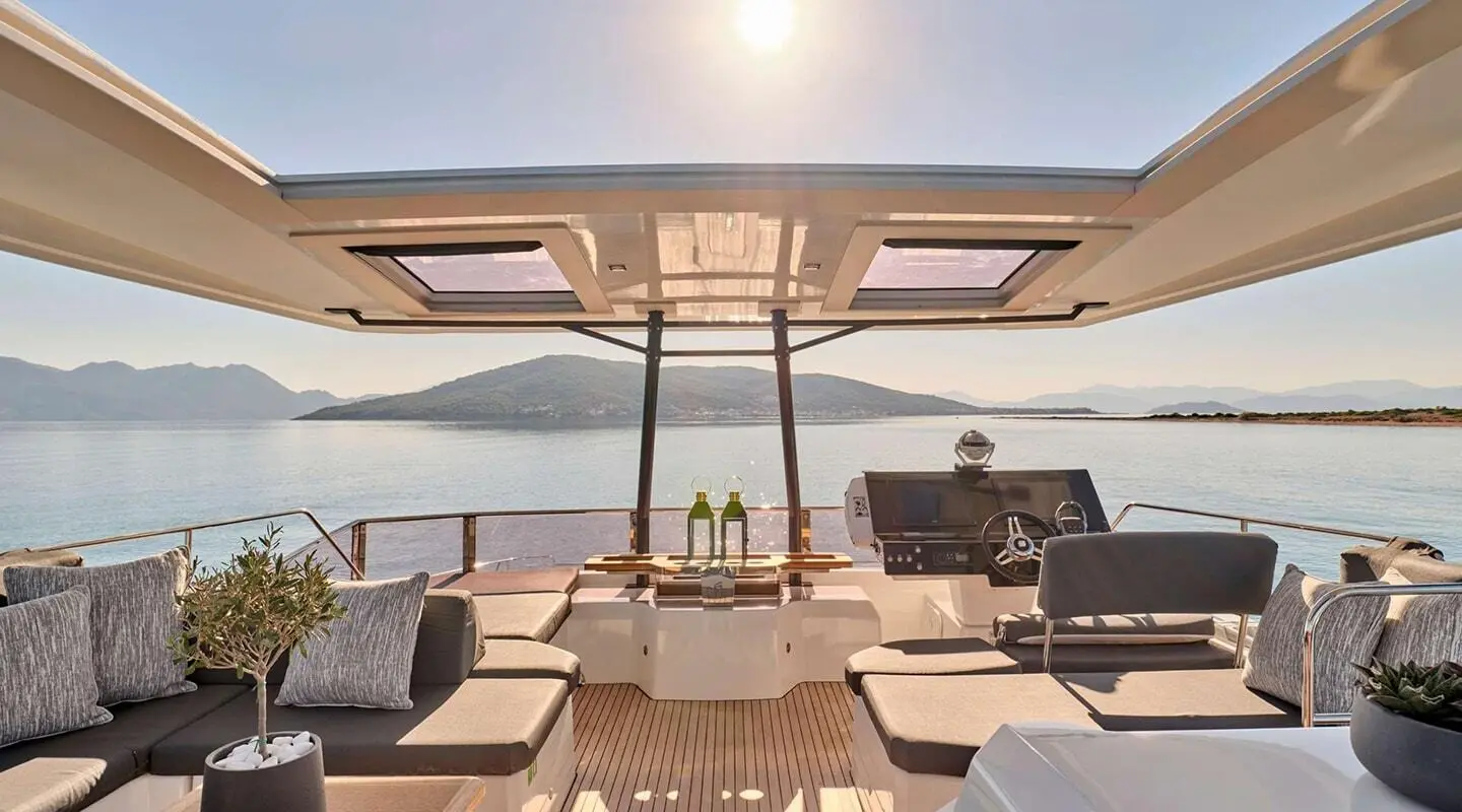 Christal Mio luxury yacht's aft deck with seating, sun loungers, and ocean view