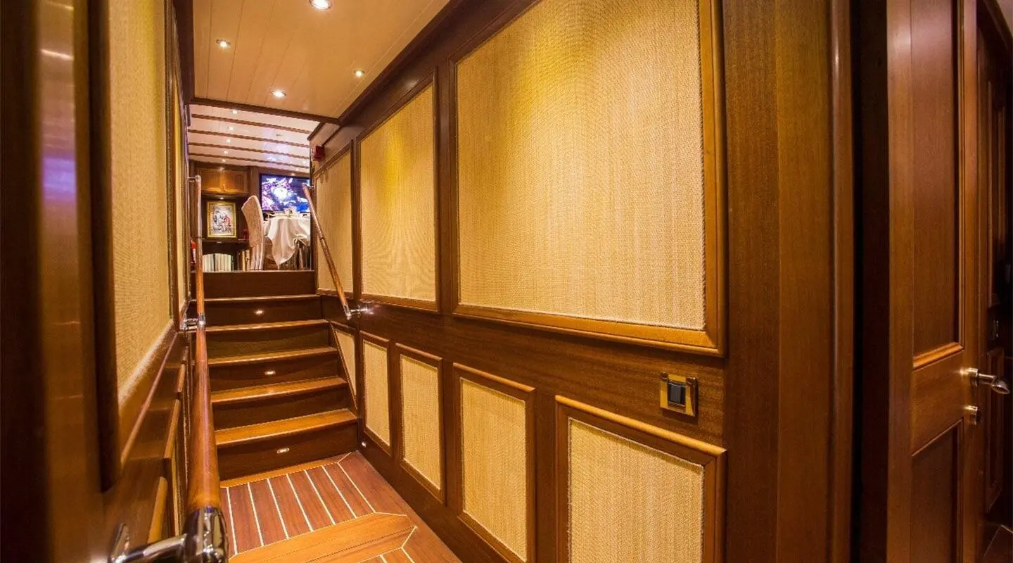 Luxurious Ece Berrak yacht at sea with calm water at sunset glow