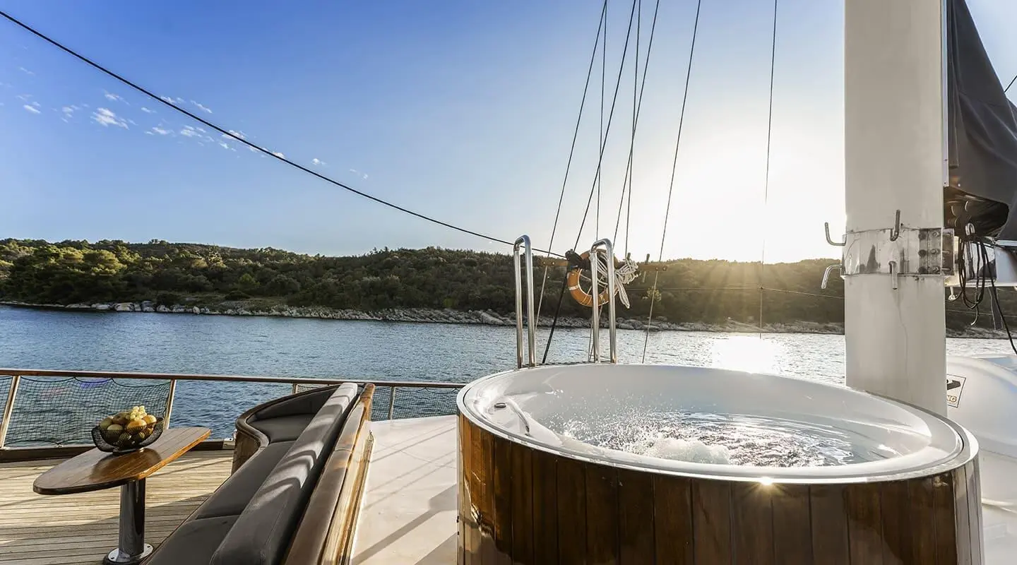 Sunset view from a luxury gulet deck in Croatia with ropes and calm water