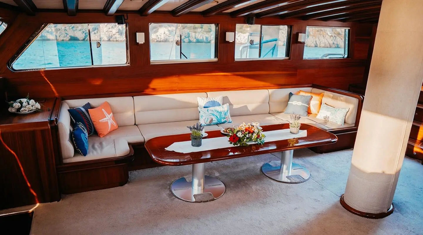 Luxurious yacht Wicked Felina seating area under awning at sunset