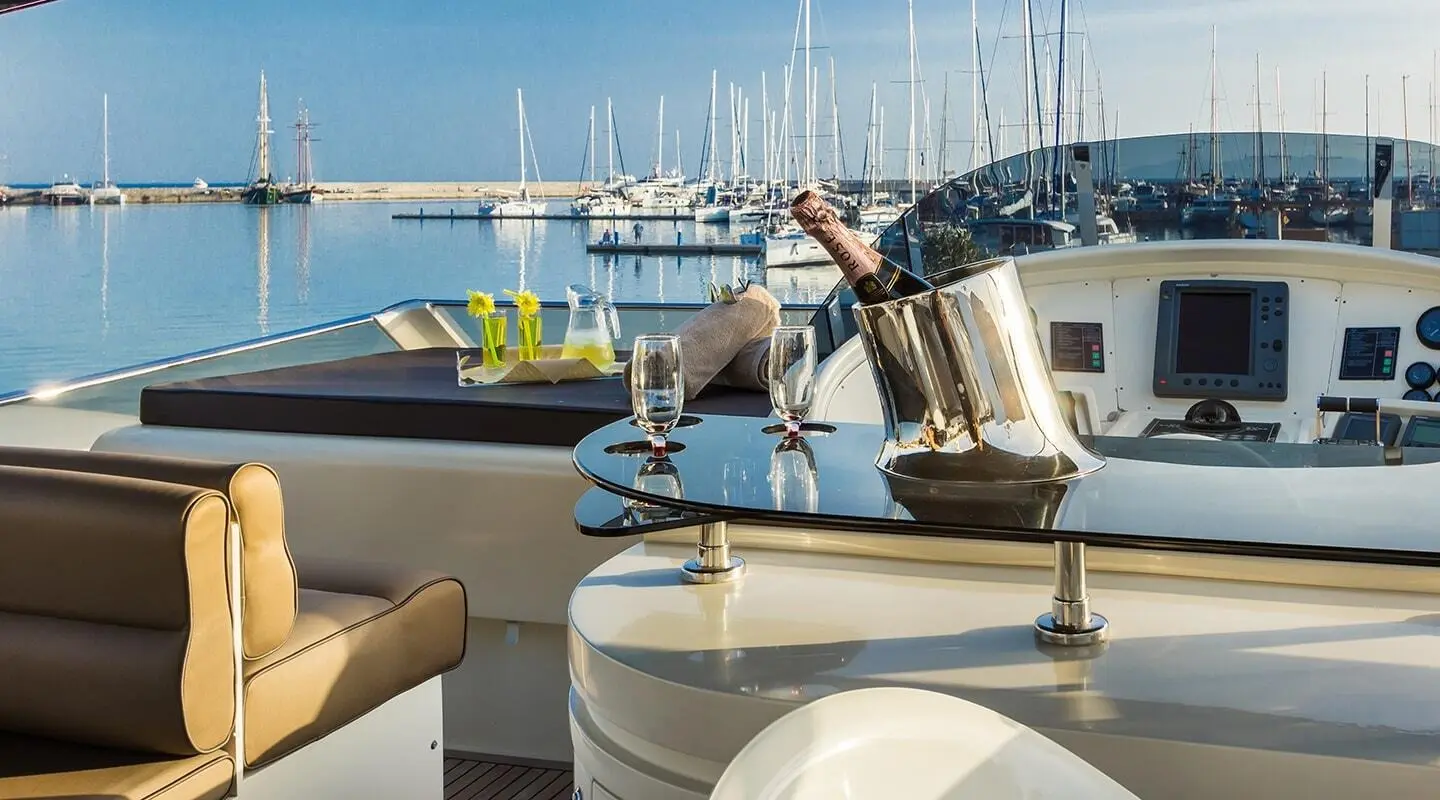 Amoraki yacht deck with champagne on ice and seating overlooking marina