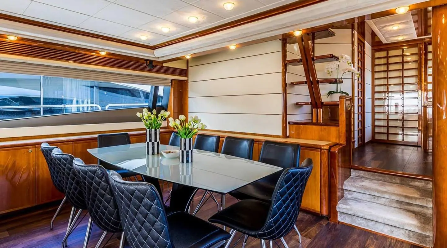 Miss Katariina yacht dining saloon with table set for meals near windows