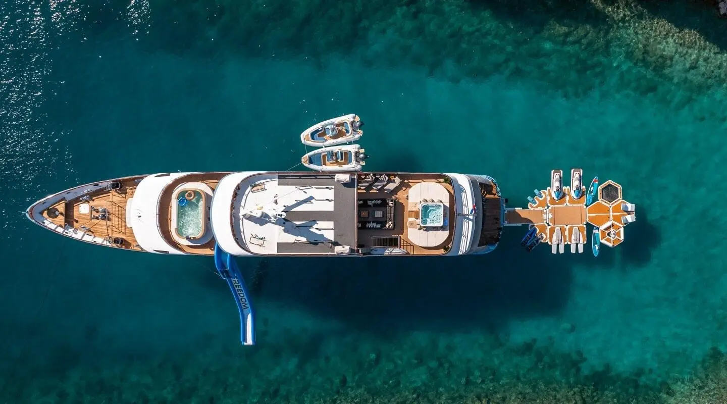 Overhead view of Freedom luxury yacht anchored in clear turquoise water