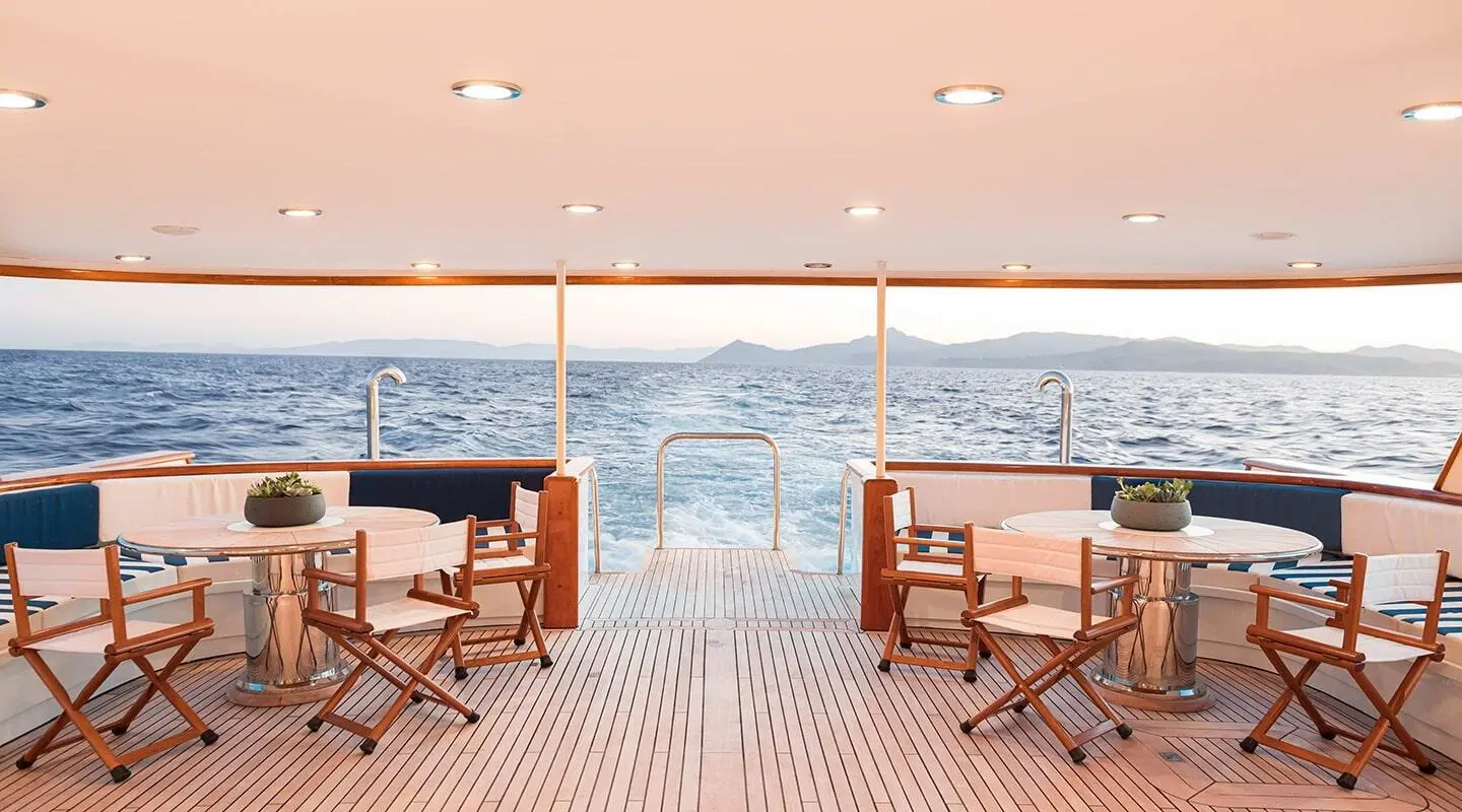 Wind Of Fortune deck at sunset with two chairs facing the oceanist sea view