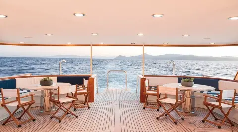Wind Of Fortune deck at sunset with two chairs facing the oceanist sea view
