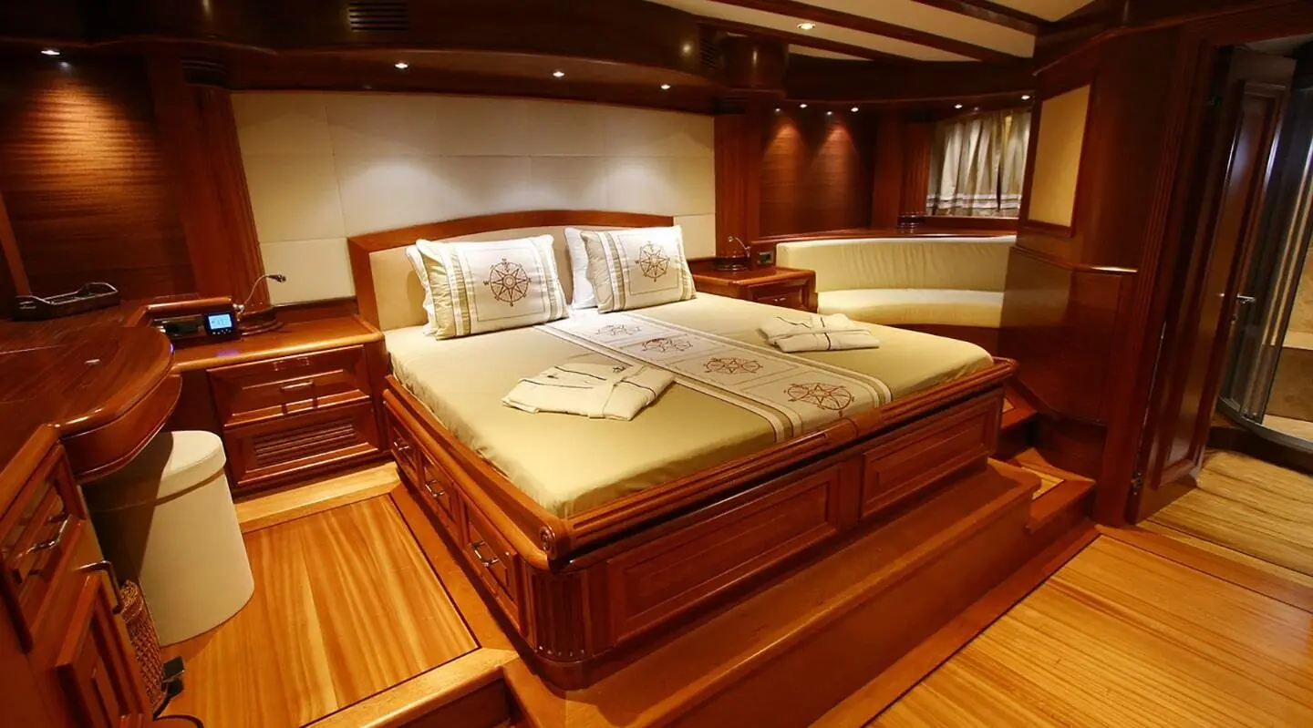 Kaya Guneri 5 yacht master cabin with large bed and wooden floors