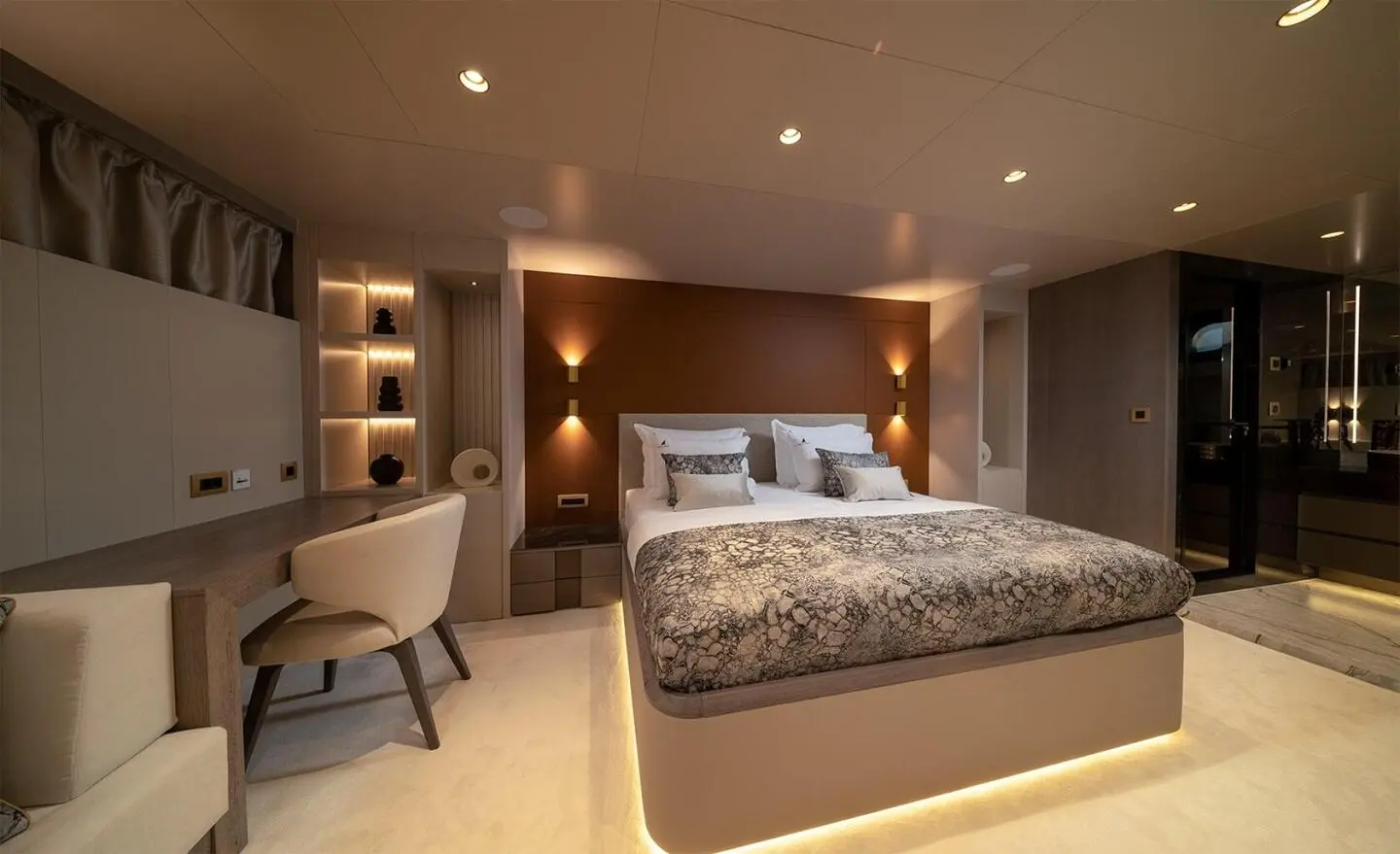 Nocturno motor yacht cabin interior with bed, seating, shelves and lighting