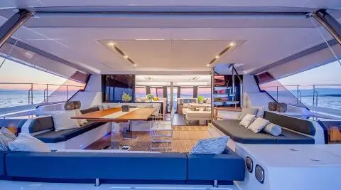 Yacht D2 aft deck with seating and sun pads under shaded area
