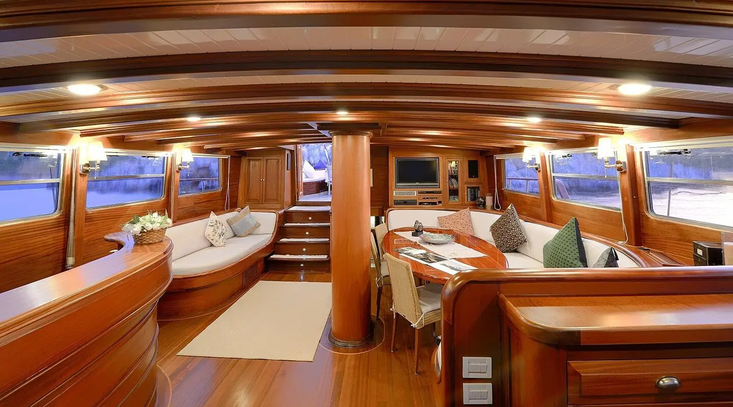 Luxurious yacht Ecce Navigo interior with wood panels and seating areas