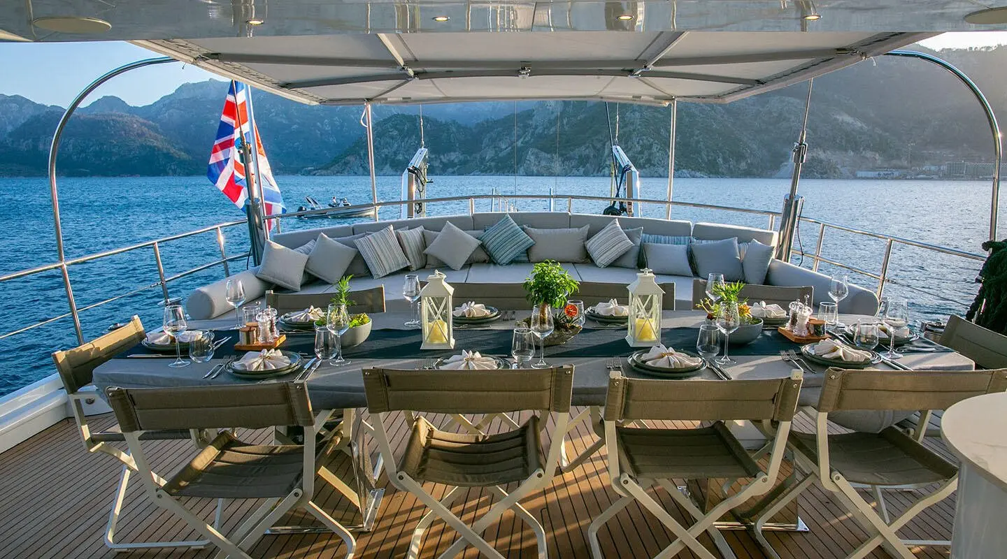 Gulet Good Life aft deck with seating and tables set, sea view