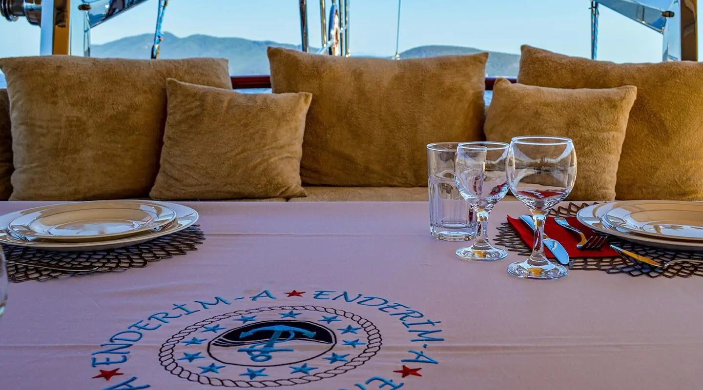 Table setup on Enderim A gulet with plates and glasses
