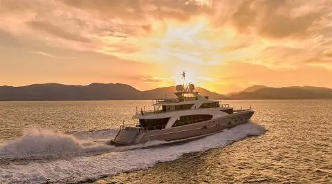 La Pellegrina 1 motor yacht cruising at sunset with warm sky and calm sea