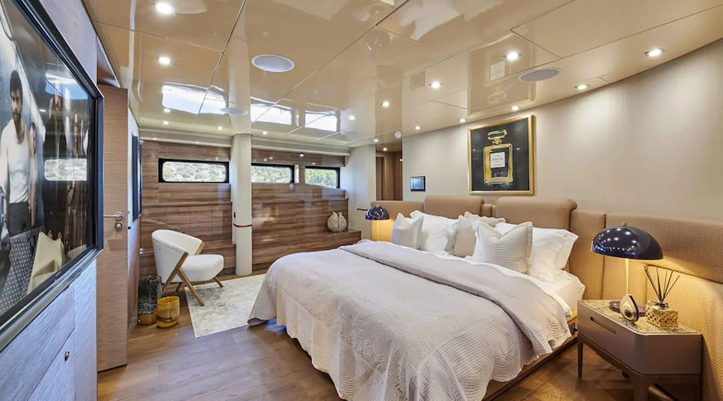 Daloli yacht master cabin with large bed and elegant interior