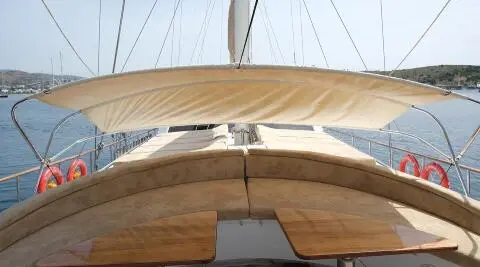 Bow deck of Queen Of Sea gulet with wooden planks and ropes visible
