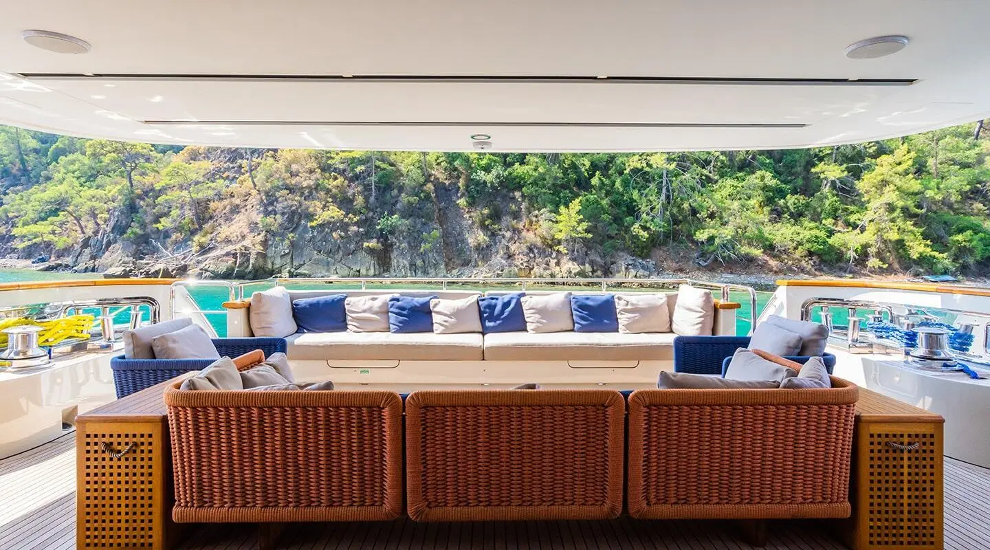 Takara One aft deck with blue cushions and seating under shaded console
