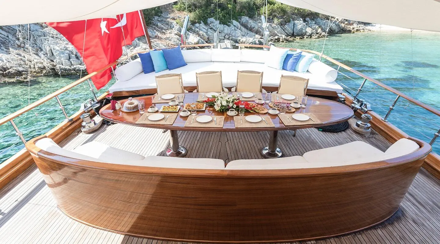 Grace 1 gulet on the aft deck with a table and chairs