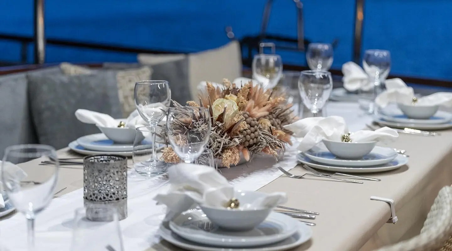 Gozdem The One yacht dining table set for guests on deck