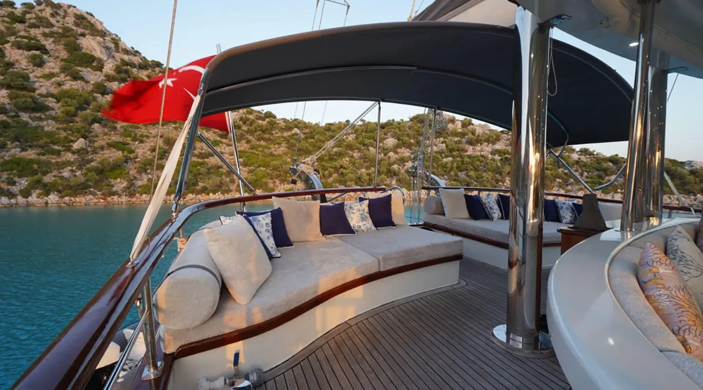 Prenses Esila yacht deck with seating, cushions, and sunset view