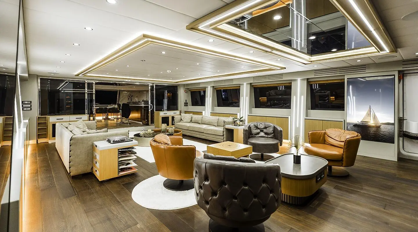 Interior lounging area aboard North Wind yacht, modern seating and bar