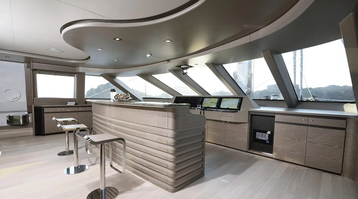 Interior bar area aboard All About U 2 yacht with wood cabinetry and seating