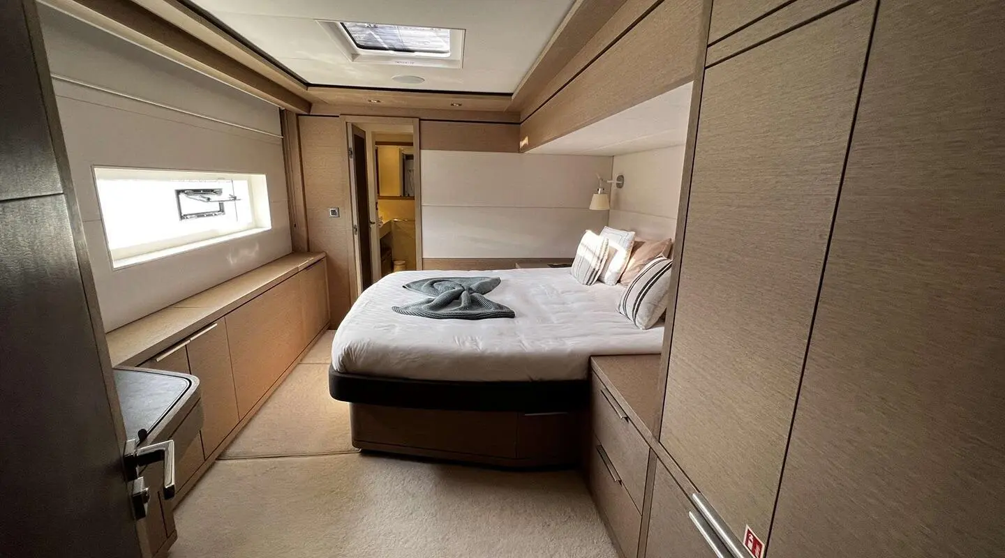 Just Marie 2 charter yacht interior with a double bed and wood panels