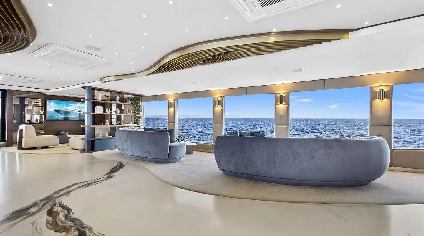Bella yacht salon with blue upholstery seating and white floor