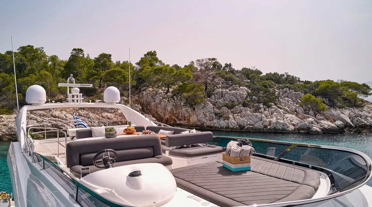 Yacht M Five docked at sunset with lounge deck and water nearby
