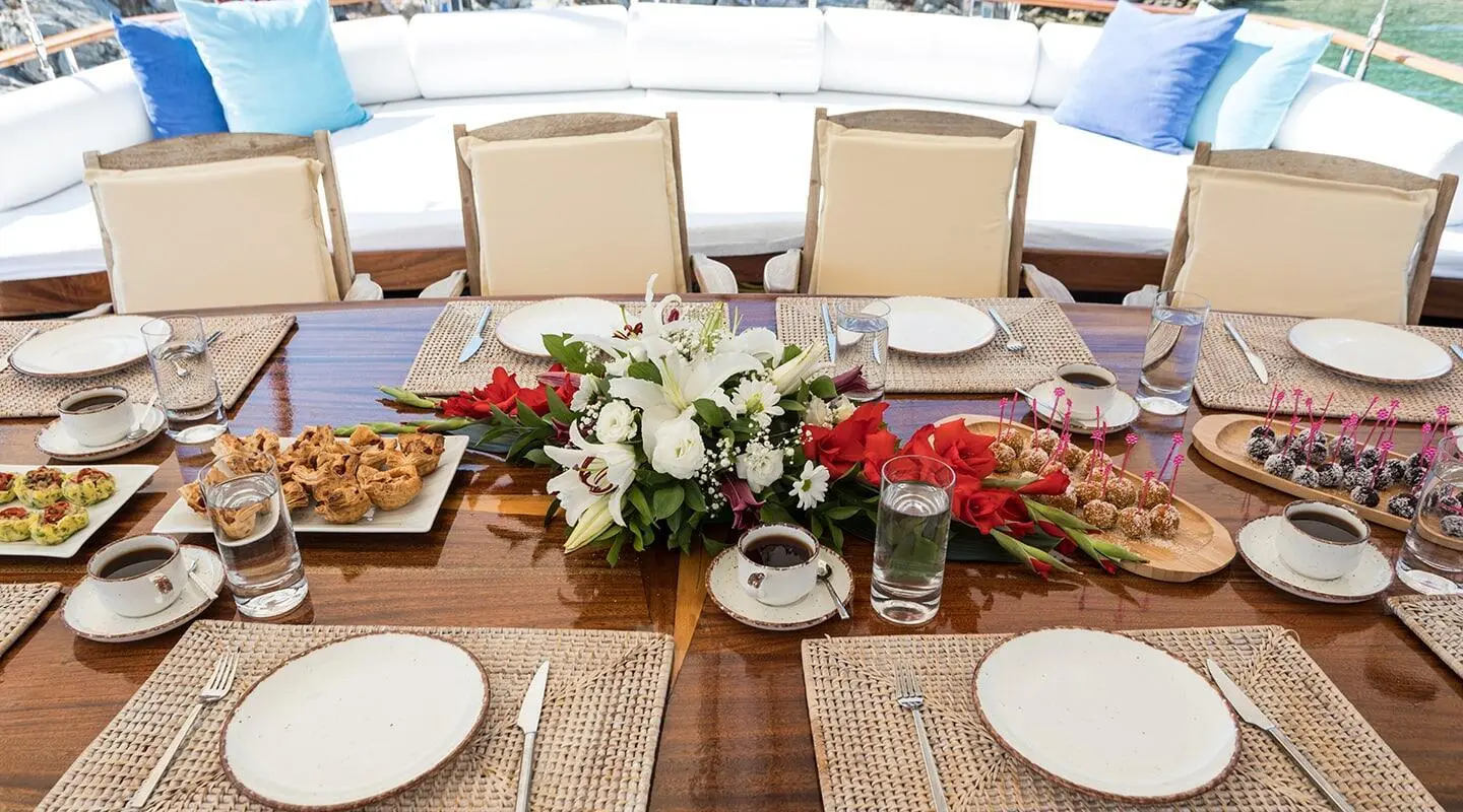Grace 1 yacht table setting with flowers, candles, and place settings