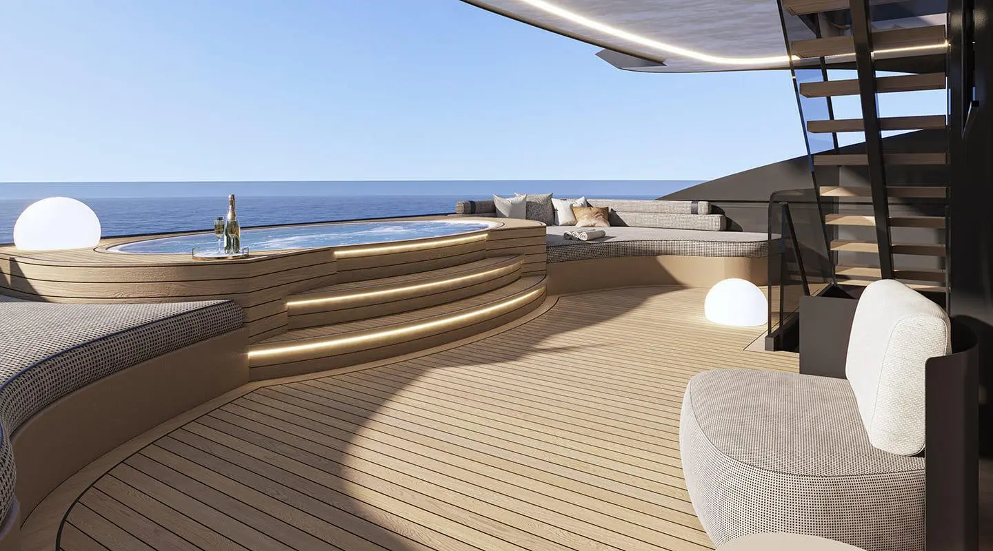 Upper deck of Bello yacht with sun loungers and blue sky