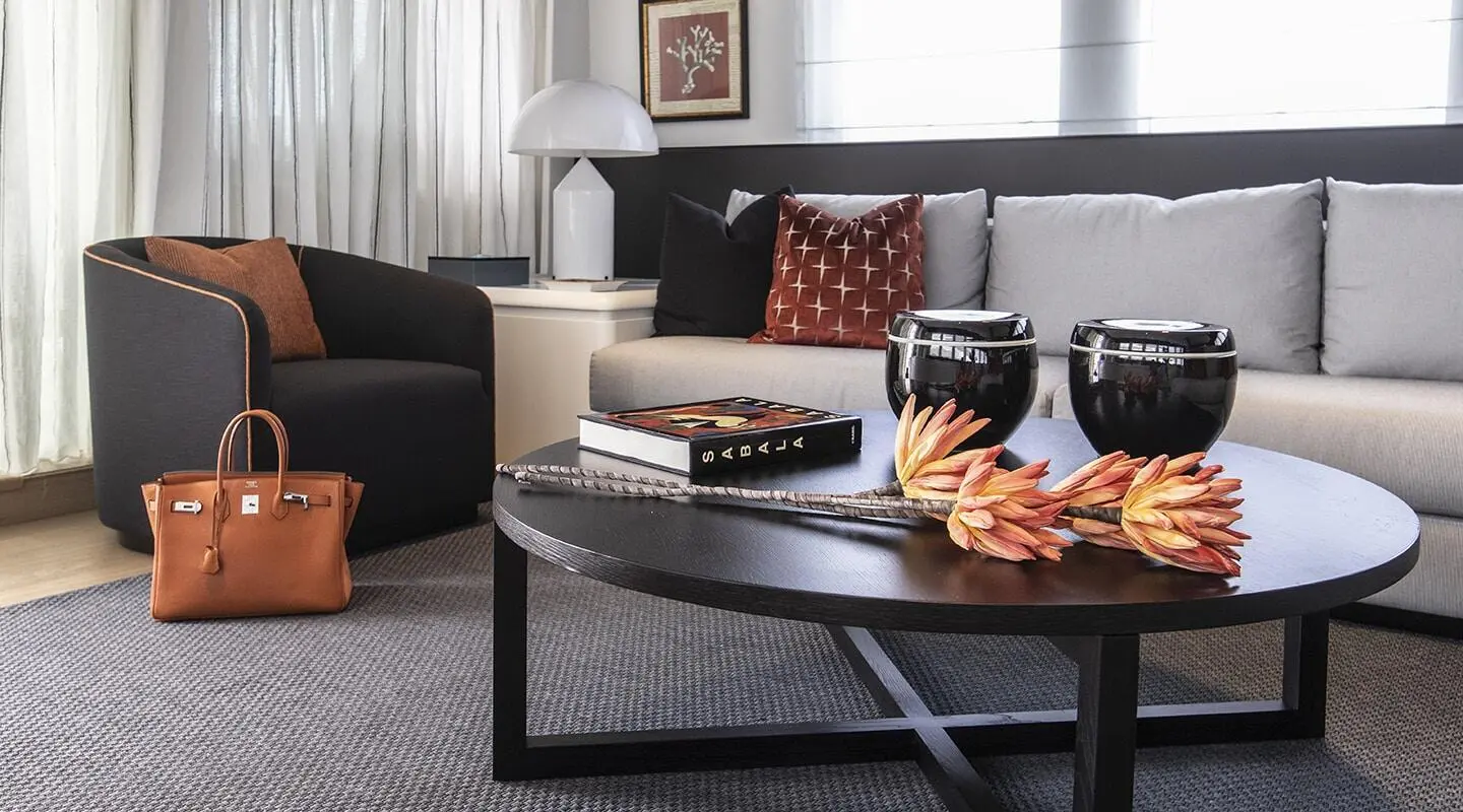 Interior lounge of Project Steel motoryat with table, seating, and snacks