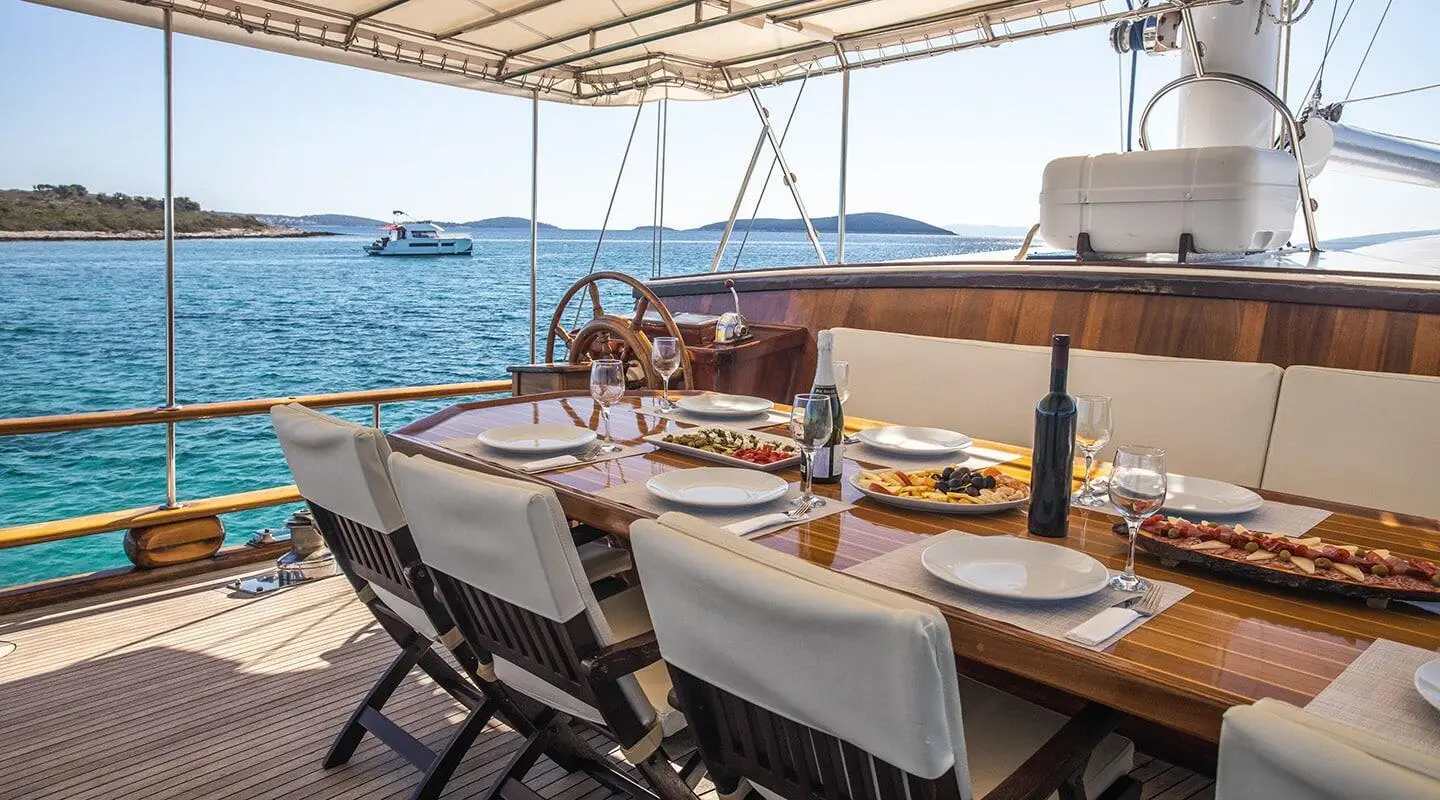 Andi Star gulet aft deck with dining area and chairs