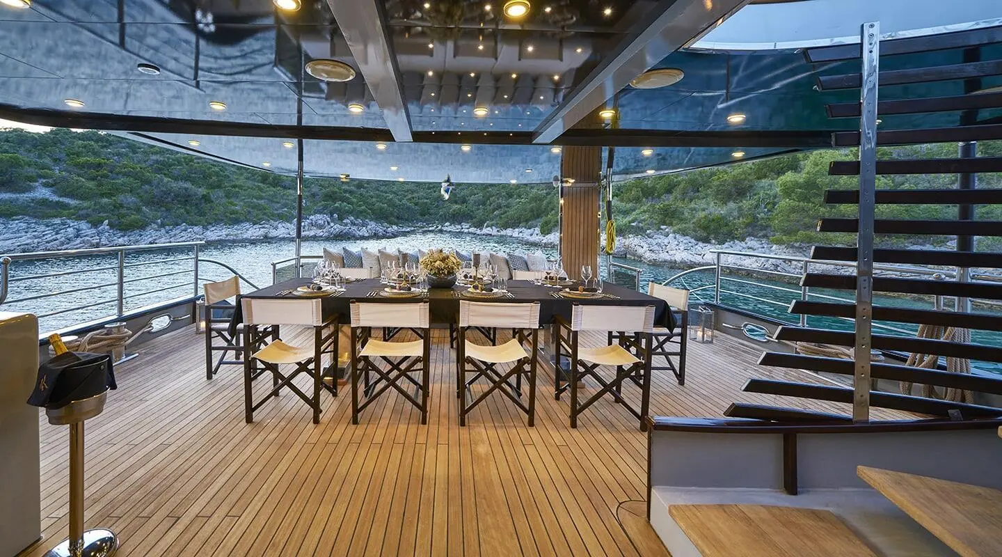 Rara Avis yacht aft deck with table and chairs