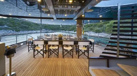 Rara Avis yacht aft deck with table and chairs