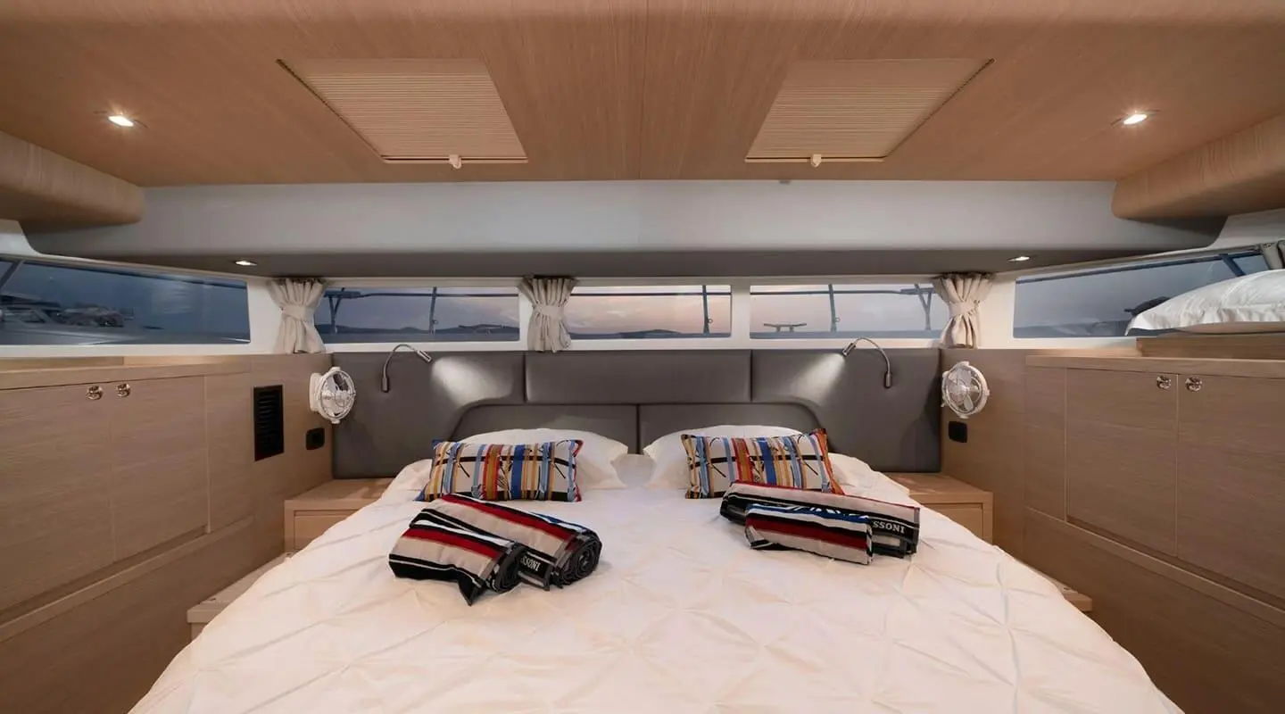 Yacht interior with two cabins and forward lounge area