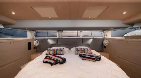 Yacht interior with two cabins and forward lounge area