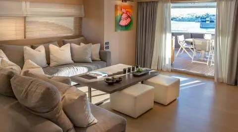 Interior view of Summer Fun motor yacht salon with seating area and table